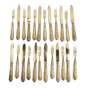 Charlie Jacques London Gilt Sterling Silver Fruit or Dessert Forks Knives for 12: 24 piece Charlie Jacques London gilt sterling silver fruit or dessert forks and knives for 12. Gilt silver with etched putti with musical instruments and florals to handles. Charlie Jacques sterling