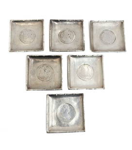 6 Continental Silver 1786 Spanish Coin Inset Square Dishes: 6 Continental Silver 1786 Spanish coin inset square dishes. 1786 Spanish Dei Gratia Hispania coins inset to center. Approximate weight: 13.14 ozt Measurements: Approx., 3.25 inches x 3.25 inches 