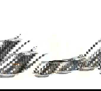 The Kalo Shops Arts & Crafts 4pc Silver Tea Coffee Set: The Kalo Shops Arts and Crafts 4 piece sterling silver tea & coffee set, circa 1915. Hand hammered decoration to the body, natural carved joints to tea and coffee pots, finials. Creamer with gilt