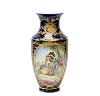 Sevres Style Hand Painted Porcelain Vase Artist Signed c. 1920: Sevres Style porcelain vase, circa 1920. A cobalt blue ground with raised gilt floral and foliate decoration. Hand painted image of a courting scene to one side, a landscape scene to the other.