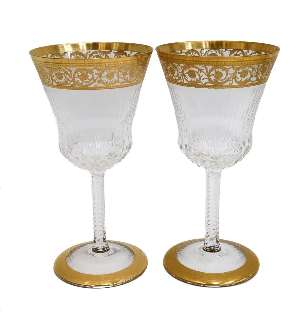 Pair Saint (St) Louis France Cut Glass Burgundy Wine Goblets in Gold Thistle: Pair Saint (St) Louis France cut glass burgundy wine goblets in Gold Thistle. Gold encrusted notched foliate scrolls with cut multi-sided exterior. Acid etched St. Louis mark to the underside. Weight: