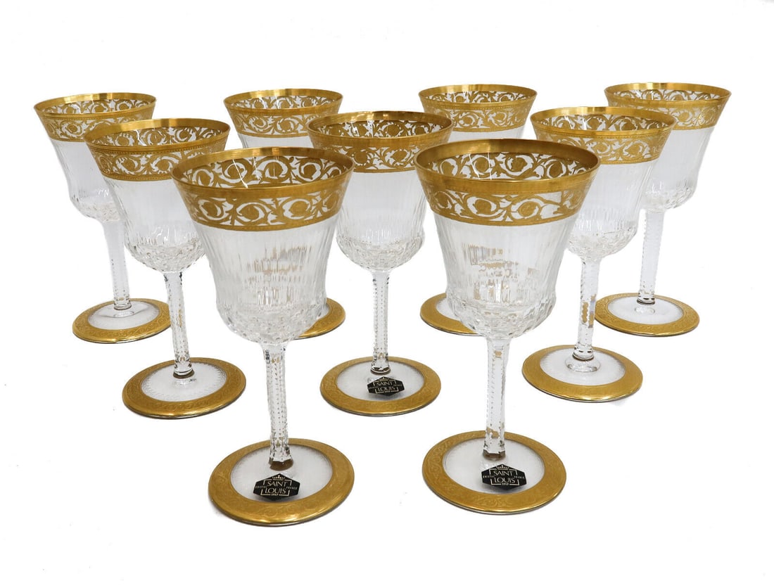 9 Saint (St) Louis France Cut Glass Claret Wine Goblets in Gold Thistle: 9 Saint (St) Louis France cut glass claret wine goblets in Gold Thistle. Gold encrusted notched foliate scrolls with cut multi-sided exterior. Acid etched St. Louis mark to the underside and 3 with or
