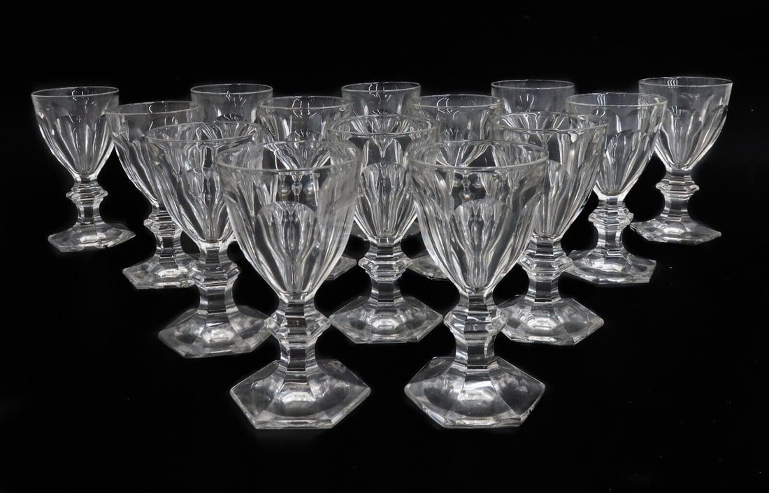 14 Baccarat France Cut Glass White Wine Goblets in Harcourt Versailles Signed: 14 Baccarat France cut glass white wine goblets in Harcourt Versailles. Cut panel design to bowl with a multi-side foot. Acid etched Baccarat mark to underside. Weight: Approx. 10 lbs Measurements: Ap