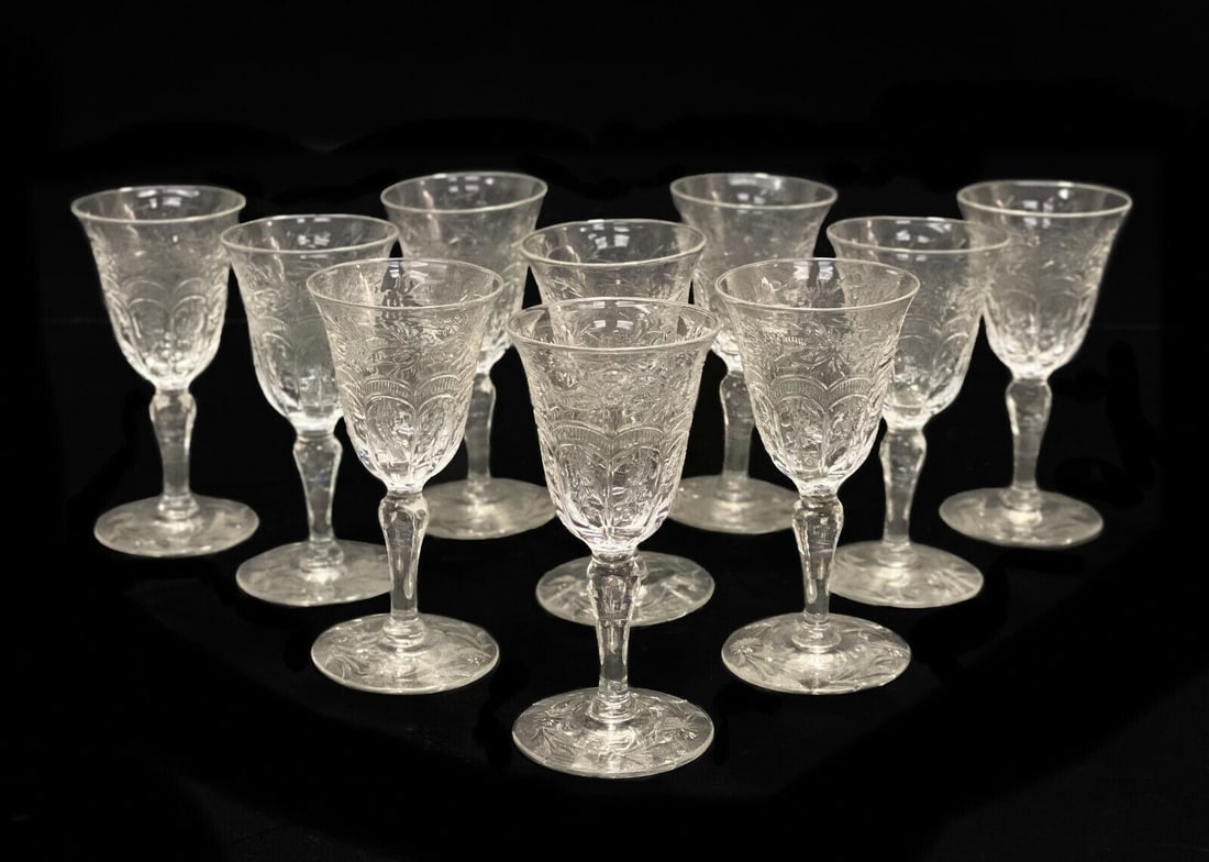 10 Continental Cut Glass Emulating Rock Crystal Cordial Wine Goblets, circa 1960: 10 Continental cut glass emulating rock crystal cordial wine goblets, circa 1960. Intricate cut flowers throughout the exterior and to the base. Continental, but likely French. Weight Approx., 4 lbs M