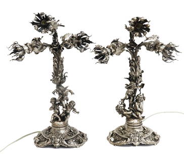 Pair Lazarus Posen German 800 Silver Cherub and Foliate Leaf Lamps: Pair Lazarus Posen German 800 Solid Silver Cherub and Foliate Leaf Lamps. The lamps depict cherubs with eleaborate foliate scrolls. Marked Lazarus Posen 800 to edge. Weight Approx., 129.69 ozt all