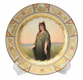 Royal Vienna Hand Painted Cabinet Plate, circa 1900: Royal Vienna hand painted porcelain cabinet plate, circa 1900. The central image of the plaque is a hand painted portrait of a beauty in the middle of a field. signed in the lower right corner.