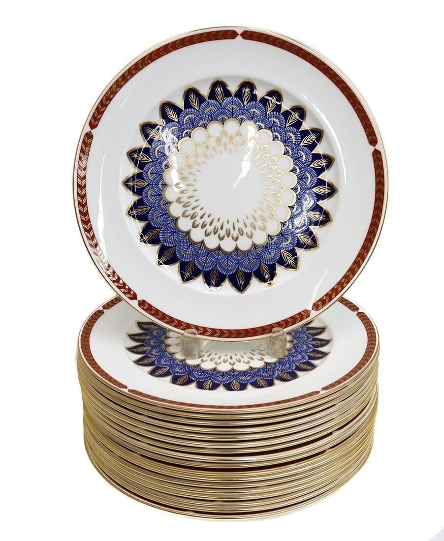 18 Royal Crown Derby England Porcelain Charger or Service Plates in Quail 20th C: 18 Royal Crown Derby England Porcelain Charger or Service Plates in Quail, Late 20th Century. Rust red and gold feathered rim with a blue and gold blue quail feathered emblem to center. Royal Crown De