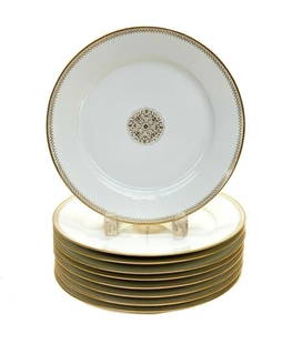 10 Manufacture De Sevres Porcelain 9.5 inch Plates, Gilt Emblems, 1865: 10 Manufacture De Sevres France porcelain 9.5 inch plates, 1865. Gilt ribbons around the edge of the plate with emblems to the center. Manufacture De Sevres mark to the underside. Weight: Approx. 10 l