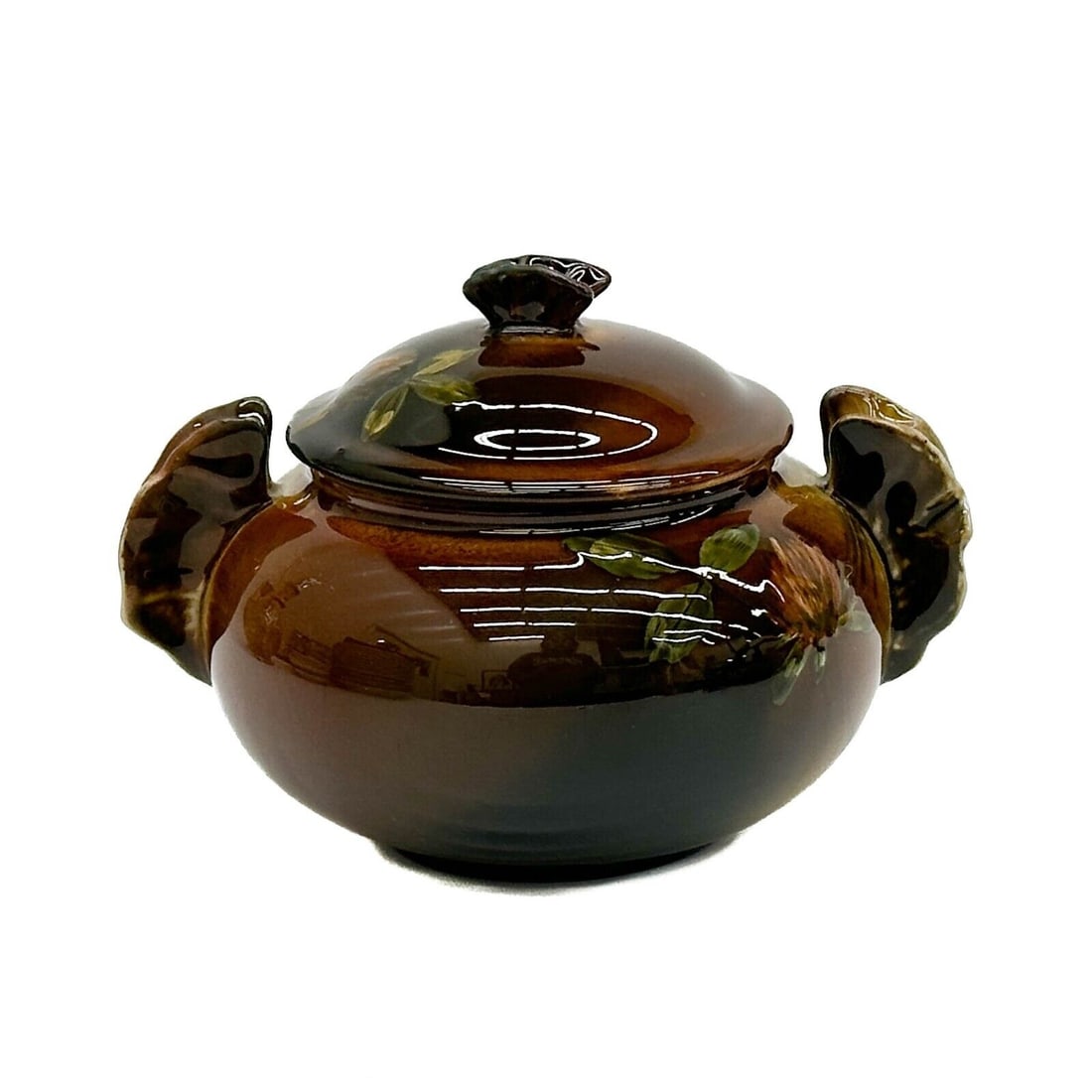 Rookwood Pottery Glazed Sugar Bowl or Lidded Jar by Grace Young 1890 #329 W: Rookwood Pottery Glazed Sugar Bowl or Lidded Jar by Grace Young 1890 #329W. A dark brown and yellow ground, painted flowers to the sides. Underside with Rookwood marks, artists cipher for Grace Young.