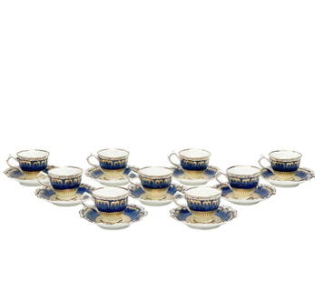9 George Jones & Sons Crescent Hand Decorated Porcelain Demitasse Cup & Saucers: 9 George Jones & Sons Crescent hand decorated porcelain demitasse cup & saucers, circa 1910. A blue ground to the ruffled edge with scalloped gilt decoration. An off-white ground to center with colorf