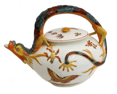 Wedgwood England Porcelain Japonisme Dragon Teapot by Hugues Protat 1872: Wedgwood England Porcelain Japonisme Dragon teapot by Hugues Protat, 1872. Multicolored figural dragon to spout and handle. Hand painted butterflies to exterior. Impressed Wedgwood mark to underside.