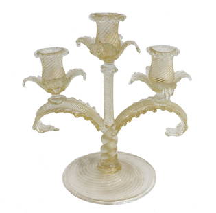 Murano Gold Fleck Art Glass Candelabra, circa 1940. Swirled and Foliate Leaves: Murano gold fleck art glass 3-arm candelabra, circa 1940. Swirl form body with foliate leaf arms. Pontil underside. Weight: Approx. 1.5 lbs Measurements: Approx. 9 inches x 5.825 inches x 10.25