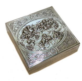 French Silver Repousse Vanity or Cigar Box: French silver vanity or cigar box. Repousse cherubs playing instruments and reading books in the clouds. Hand etched ribbons with laurel leaves to the edges. A coral fabric to the interior. A french s