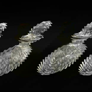 Pair Baccarat French Tetard Freres Silver Mounted Glass Bottles Decanters c1920: Pair Baccarat French Silver Mounted Glass Bottles or Decanters, circa 1920. Clear glass bottes with faceted edges, mounted silver rims with beaded edges. Underside of glass marked Baccarat France, sil