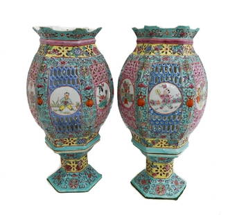 Pair Chinese Qianlong Reign Porcelain Famille Rose Reticulated  Lanterns 19th C: Pair Chinese Qianlong Reign porcelain Famille Rose lanterns, Late 19th Century. Reticulated body with hand painted enamel floral decorations. Alternating hand painted figures and birds to each panel.