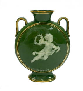 English Pate-sur-Pate Porcelain Twin Handled Moon Flask Vase, circa 1900. Cherub: English Pate-sur-Pate porcelain twin handled moon flask vase, circa 1900. A sage green ground with gilt accents. The center depicting a cherub in flight holding a floral wreath in hand. Marked "Spring