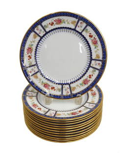 12 Royal Doulton England Porcelain Dessert Plates Decorated Flowers circa 1925: 12 Royal Doulton England porcelain dessert plates, circa 1925. Cobalt blue rim with hand decorated florals. Royal Doulton England mark to underside. Weight: Approx. 8 lb Measurements: Approx. 9 inches