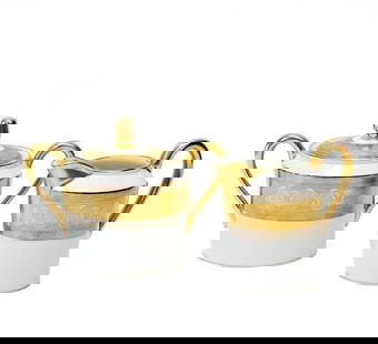 2pc Christofle France Gilt & Platinum Banded Porcelain Cream & Sugar in La Paiva: Christofle France porcelain creamer and lidded sugar bowl in La Pavia. A white ground to center, gilt to the edge and with platinum bands to the rim with floral designs. Gilt to rims and handles. Unde