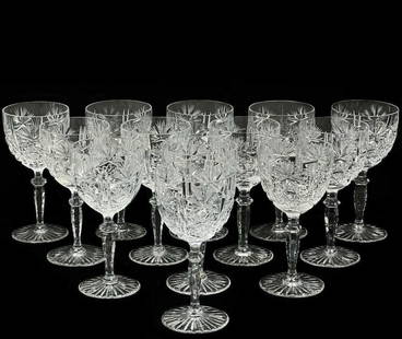 12 + 1 Wittwer Clear Cut Glass Water Goblets in Paris: 13 Wittwer cut glass water goblets in Paris. Clear glass with a cut hobstar and fan design to the bowl, a knobbed stem and a cut foot. Weight Approx., 11 lbs Measures Approx., 3.625 inches diameter x