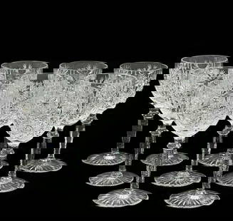 7 Wittwer Clear Cut Glass 6.3 inch Wine Glasses in Paris: 7 Wittwer cut glass wine glasses in Paris. Clear glass with a cut hobstar and fan design to the bowl, a knobbed stem and a cut foot. Weight Approx., 5 lbs Measures Approx., 2.75 inches diameter x 6.37