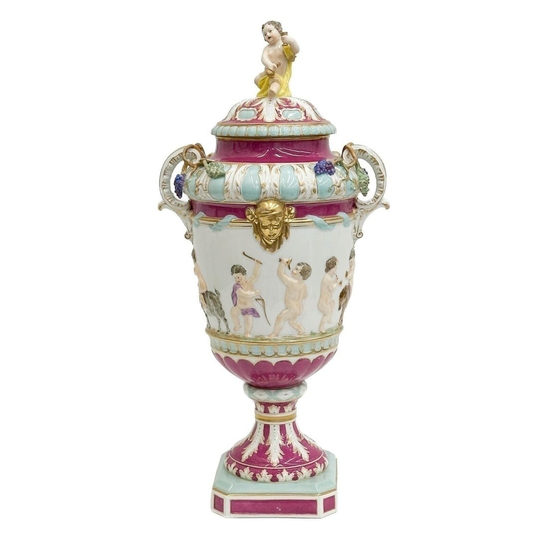 KPM Berlin Hand Painted Porcelain Covered Urn Putti 19th century: KPM Berlin Hand Painted Porcelain Covered Urn, 19th century. In the style of Capodimonte Pink and blue decoration with gilt accents, raised celebrating putti to the body, putti to the lid. Raised grap