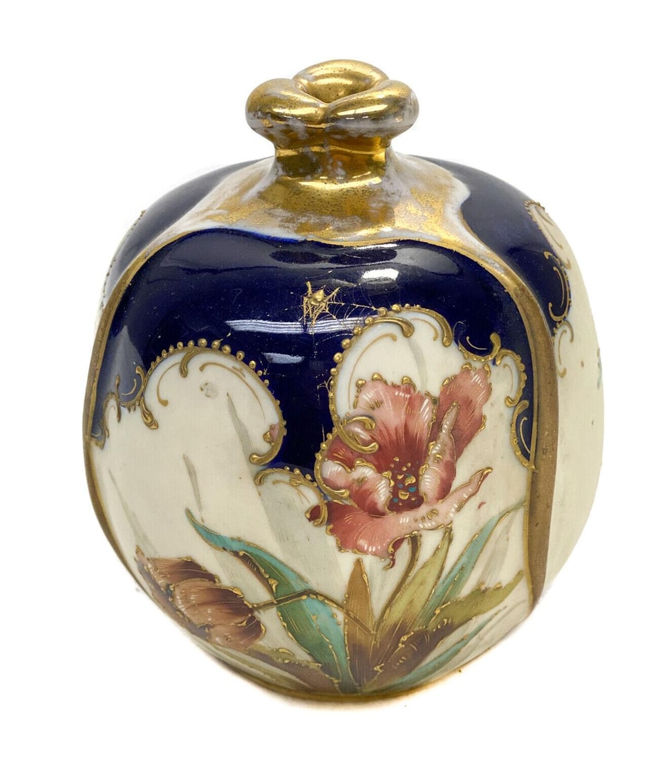 Amphora RSTK Pottery Vase. Spider Web And Flowers: Amphora RSTK Pottery round vase, circa 1900. A cobalt blue and peach ground with hand painted flowers throughout. Gilt foliate scroll and beaded accents with a gilt spider to the upper center, the gil