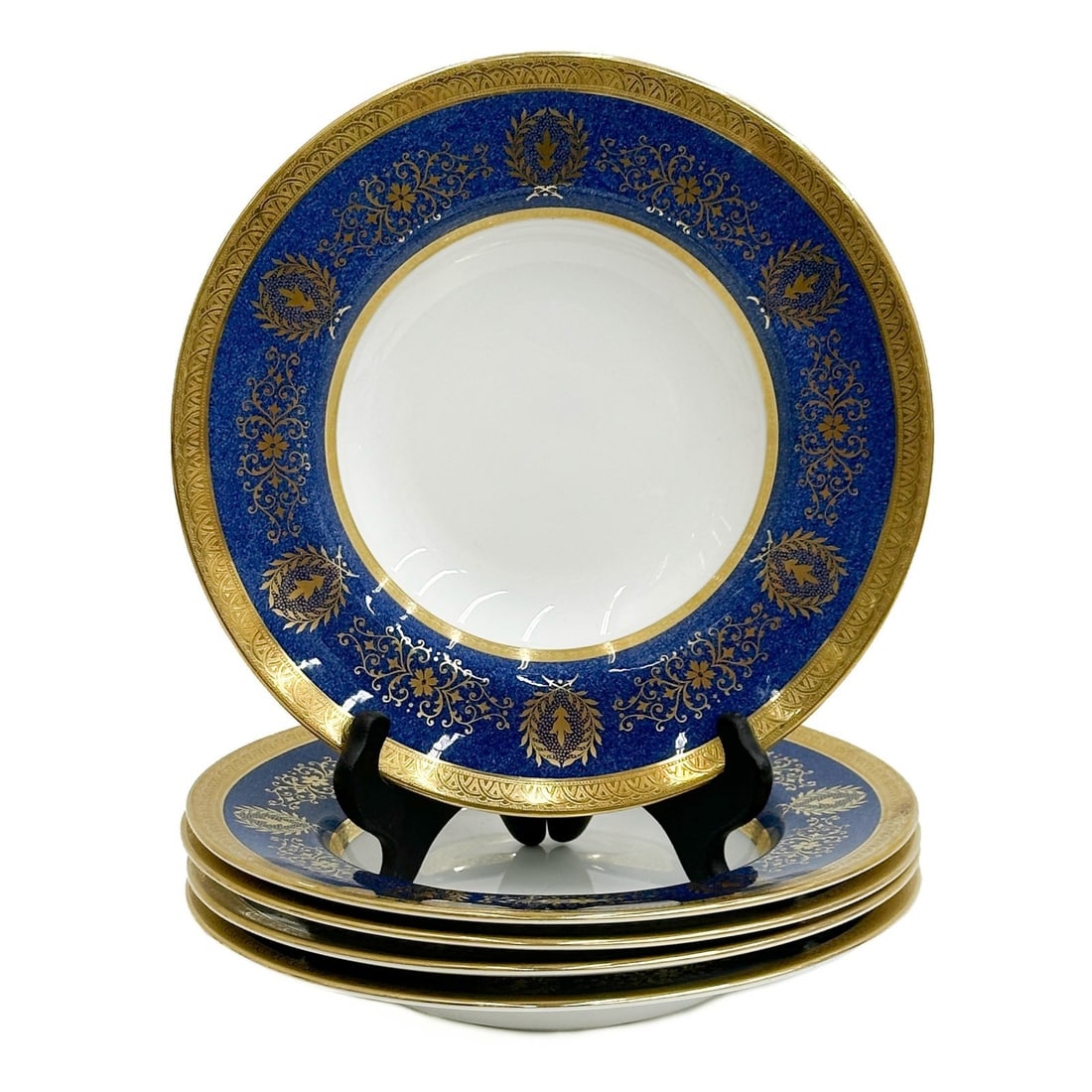 5 Coalport England Gilt Porcelain Rimmed Soup Bowls in Lady Anne c1965: 5 Coalport England Gilt Porcelain Rimmed Soup Bowls in Lady Anne. A blue ground to the edge, gilt decoration. Underside marked Coalport Lady Anne, impressed date codes for 1964 and 1967 Weight: Approx
