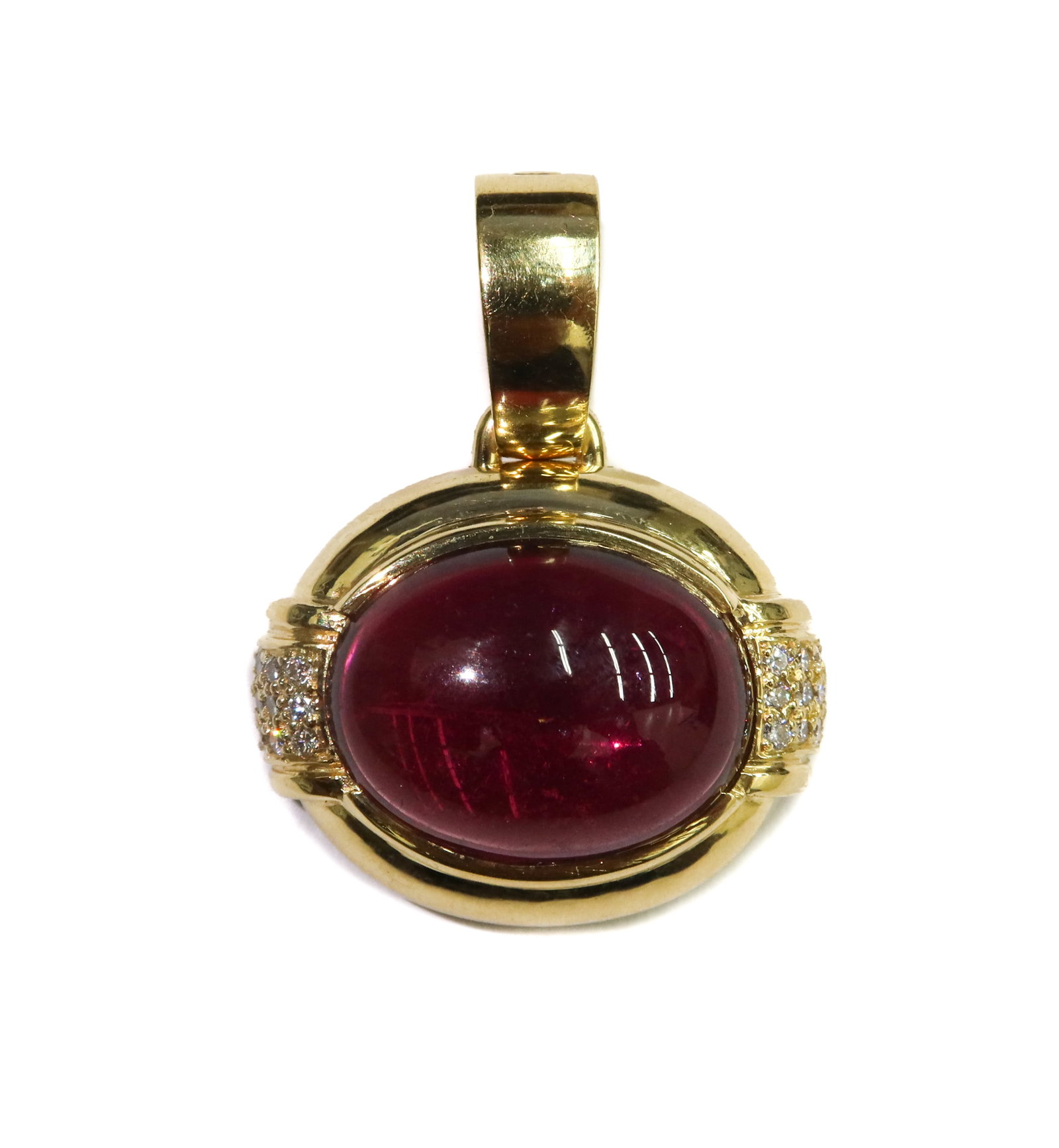 Gump's 18k Yellow Gold Cabochon Pink Tourmaline and Diamond Pendant: Gump's 18k Yellow Gold Cabochon Pink Tourmaline and Diamond Pendant. Oval cabochon pink tourmaline to center measures approx., 18.9mm x 14.2mm x 7.9mm. 24 round cut diamonds to the sides weighing appr