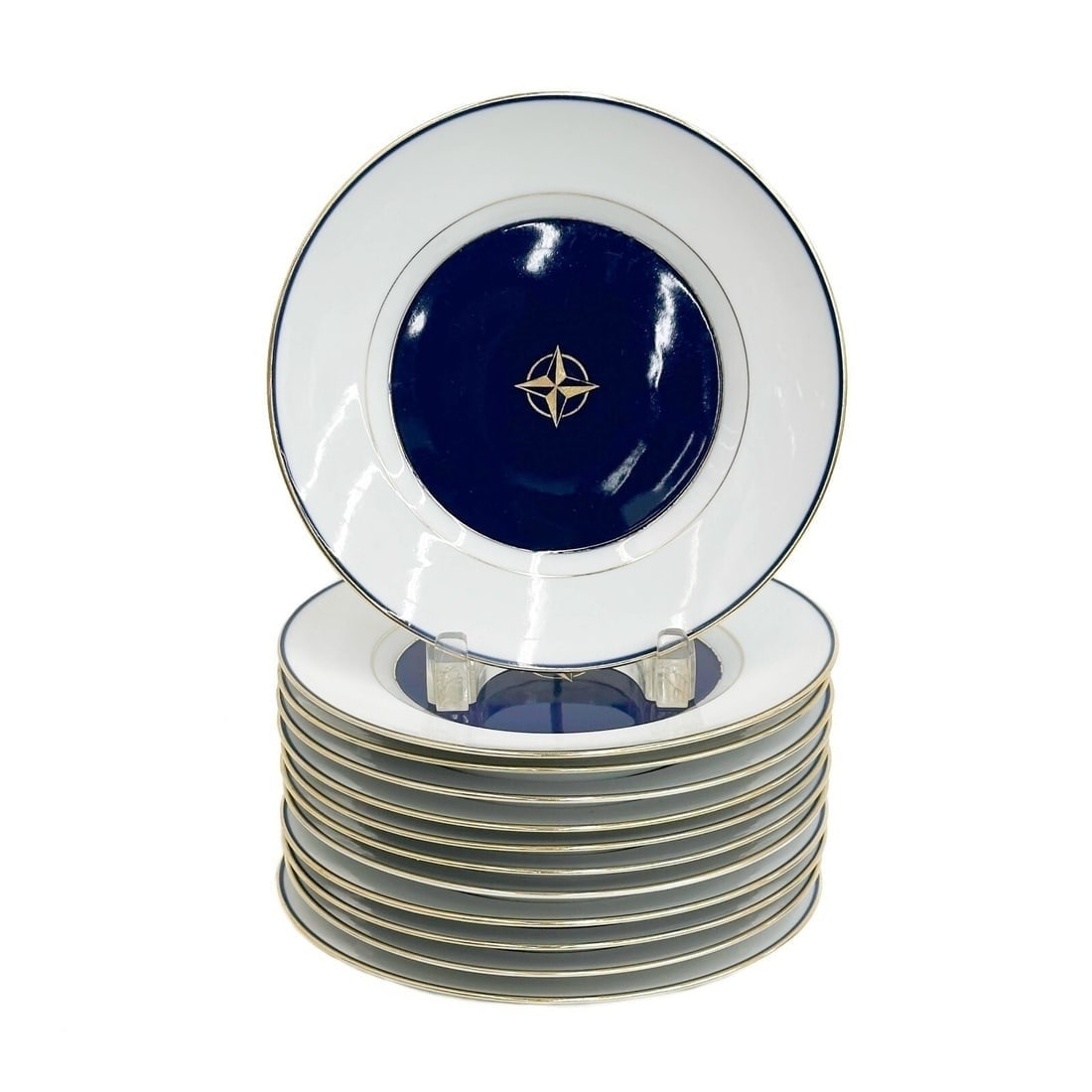12 Royal Copenhagen Denmark Porcelain 8.6 in Plates #9589 circa 1900: 12 Royal Copenhagen Denmark Porcelain Plates, circa 1900. A cobalt blue ground to the center, gilt four pointed star. Underside marked Royal Copenhagen Denmark KFX 9589 Weight: Approx. 12 lbs Measurem