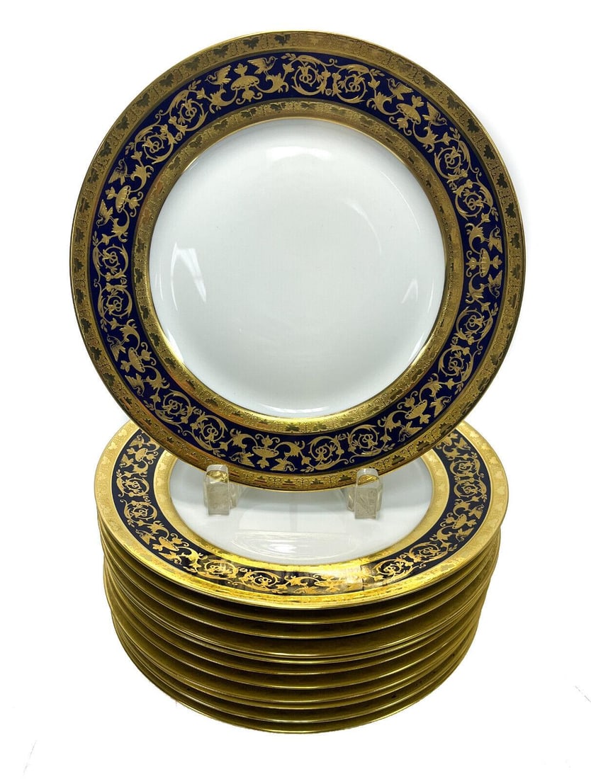 12 Limoges Raynaud Porcelain Dinner Plates in Pompei: 12 Limoges Raynaud porcelain dinner plates in Pompei. A cobalt blue ground with rich gilt birds and foliate scrolls.The “bleu de four” motifs taken from a sumptuous antique vase are hand-enhan
