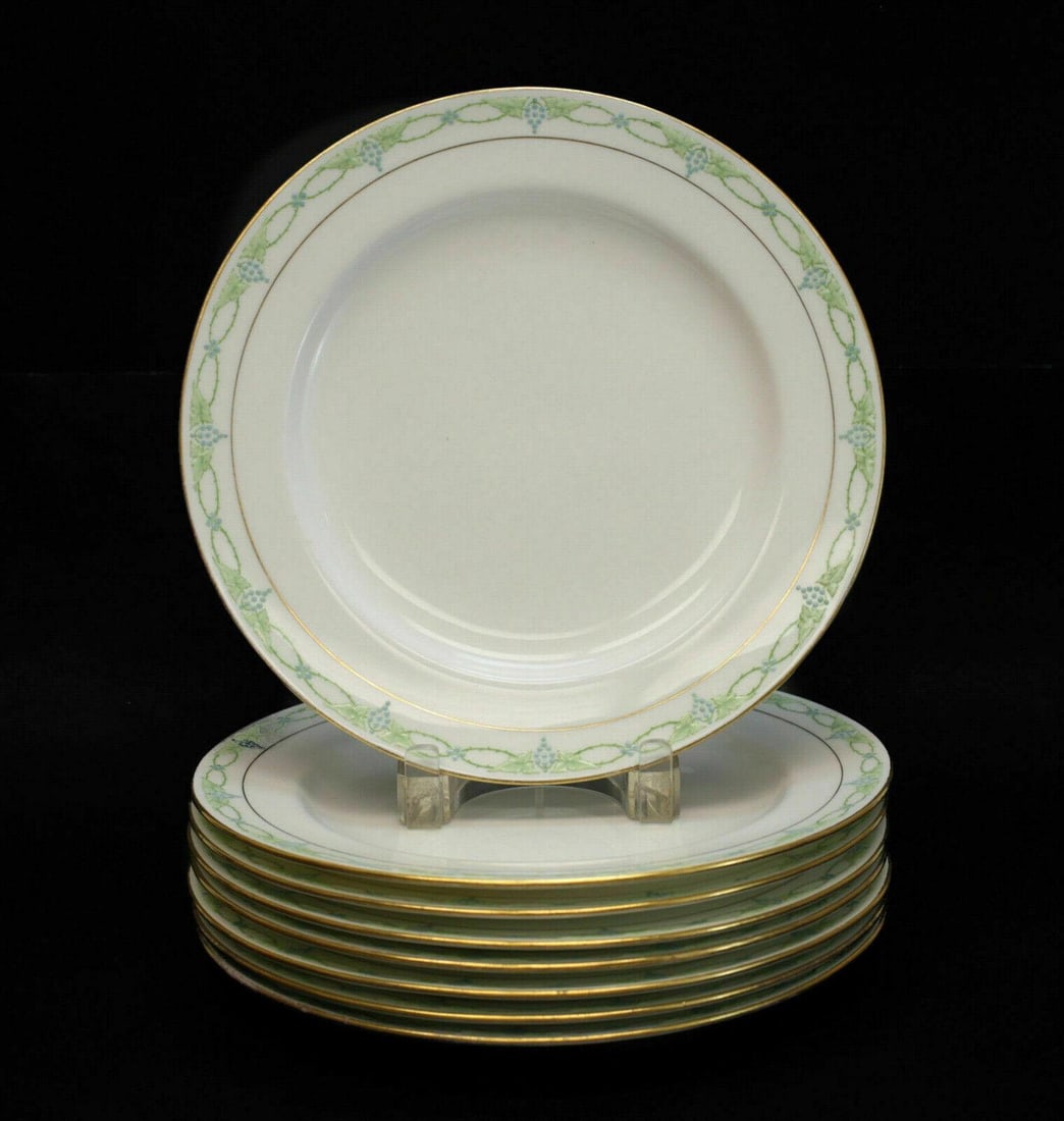 8 Minton Porcelain & Enamel Dinner Plates in Anita: 8 Minton porcelain and enamel dinner plates in Anita #H2535, circa 1900. Featuring a gold trim with blue grapes and leaves intertwined on the edges. A gilt crowned Minton Mark to the verso. Weight App