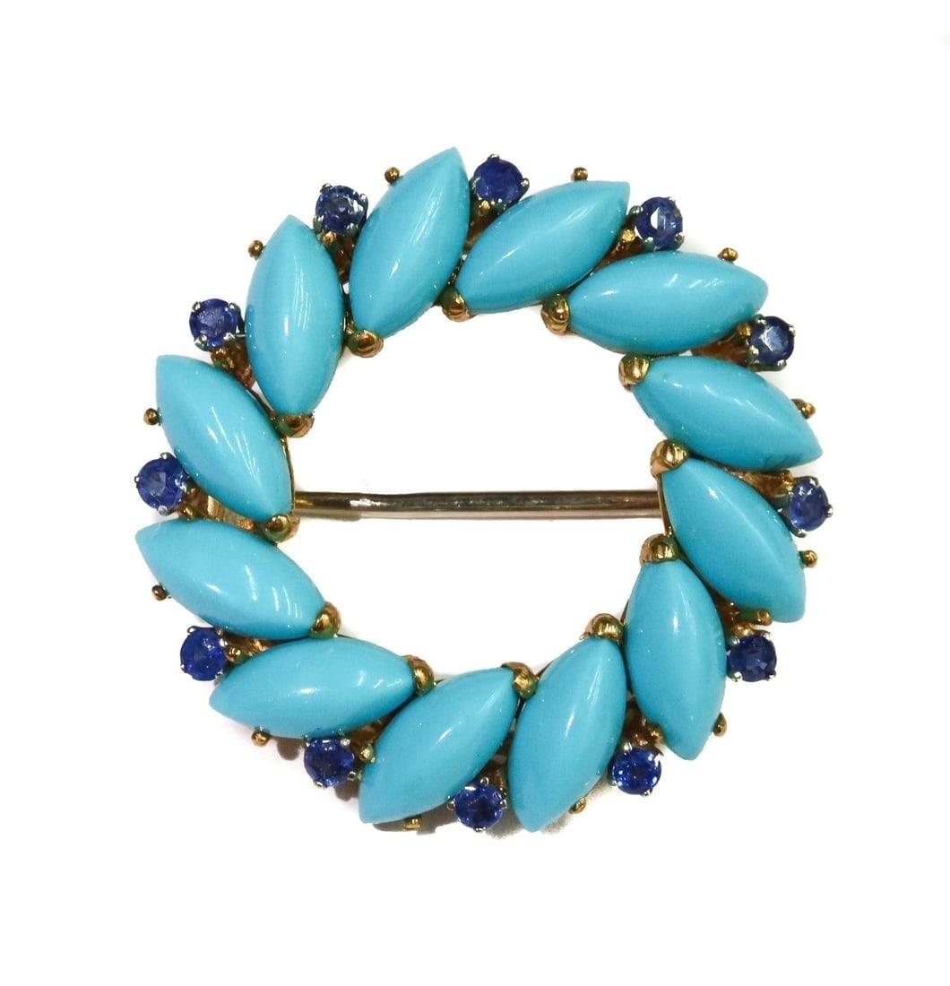 18k Yellow Gold Turqoise and Blue Spinel Round Brooch: 18k Yellow Gold Turqoise and Blue Spinel Round Brooch. 12 oval cut turqoise with alternating round cut blue spinels weighing approximately 0.6 carats. Marked 18k to edge. Weight Approx., 7.20 grams Me