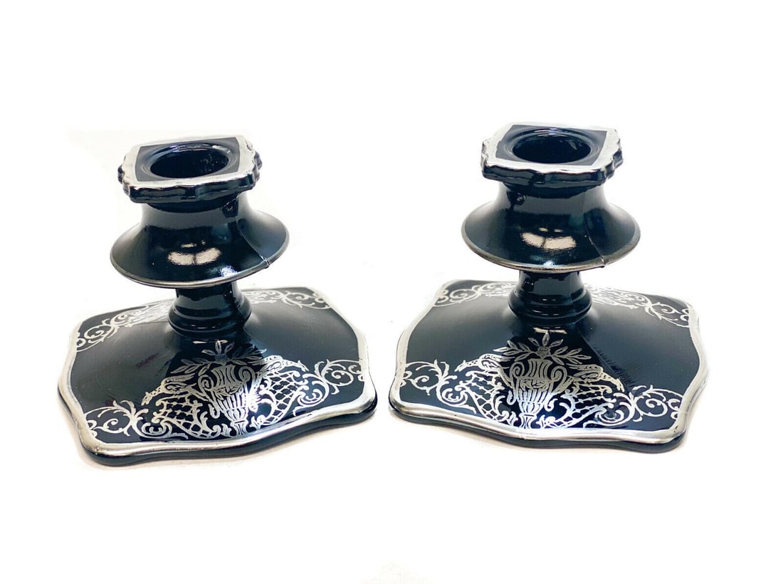 Pair Sterling Silver Overlay Black Amethyst Footed Candlestick Holders: Sterling silver overlay black amethyst candlestick holders. Figural Phoenix birds with urns to the sterling silver overlay. Weight Approx., 1 lb Measures Approx., 4.125 inches x 4.125 inches x 3.25 in