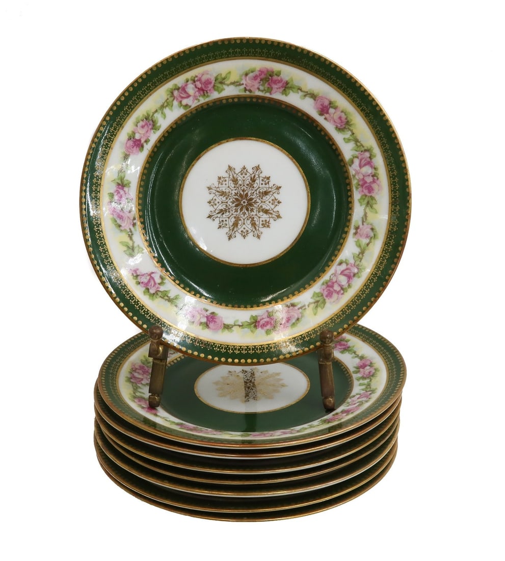 8 Limoges France by Wm. Guerin & Co. France Porcelain Bread Plates circa 1900: 8 Limoges France by Wm. Guerin & Co. France Porcelain Bread Plates circa 1900. Hunter green ground to rim with hand painted pink flowers and a gold emblem center. Limoges France mark to underside. Wei