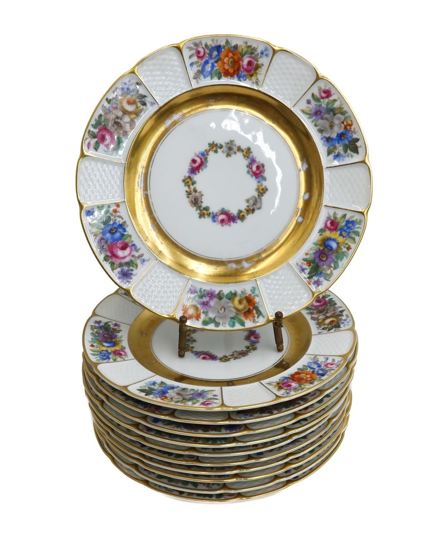 11 Rosenthal Bavaria Porcelain Dinner Plates in Barrock, 1923 Floral Gilt: 11 Rosenthal Bavaria Porcelain Dinner Plates in Barrock, 1923. Multi-colored florals to scallop rim alternating with a basketweave panel. Floral wreath to center. Rosenthal Bavaria mark to underside.