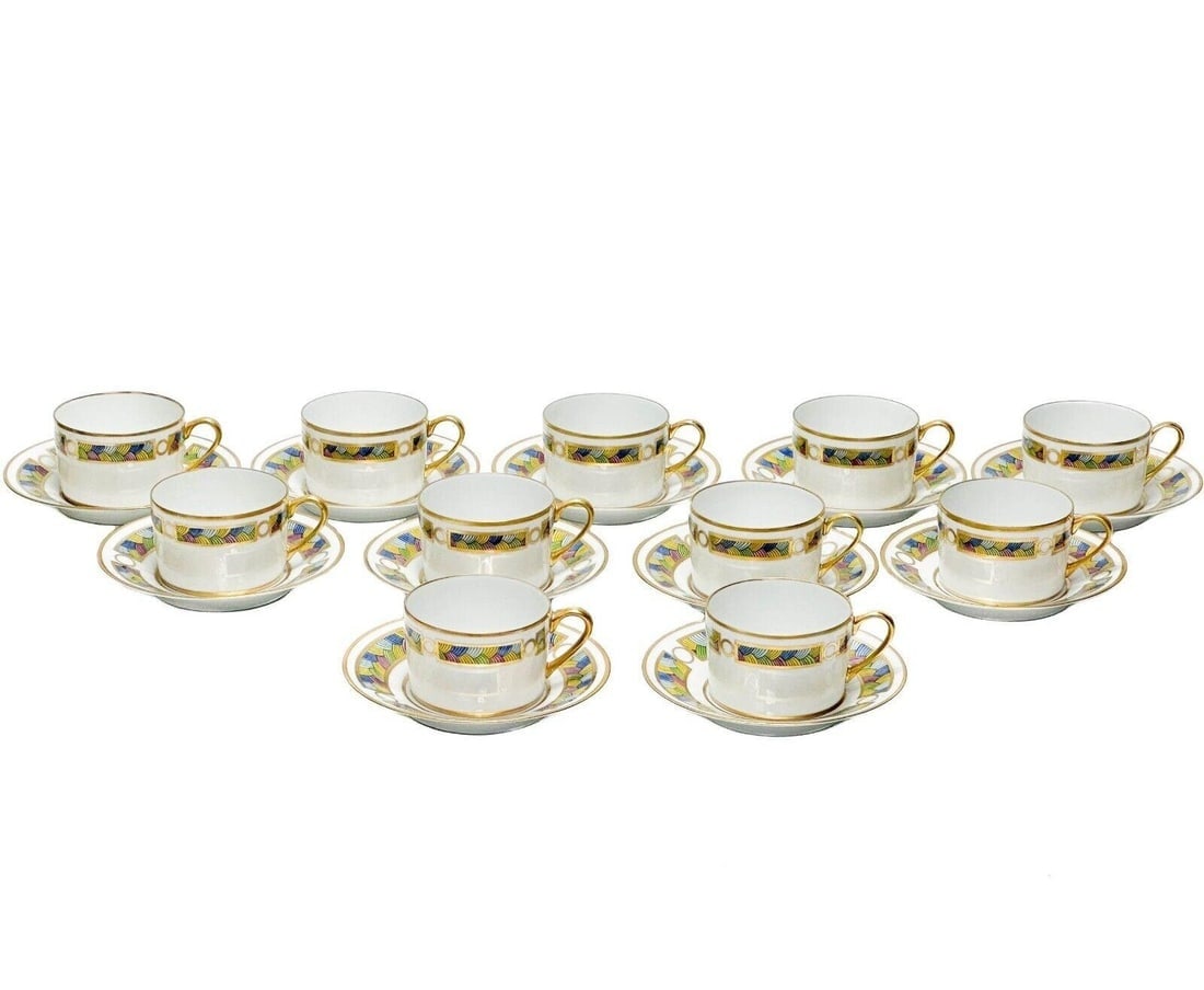11 Puiforcat Limoges France Rainbow Porcelain Cup & Saucers: 11 Puiforcat Rainbow Porcelain Cup & Saucers. A white ground decorated with bands of colorful designs within gilt accents to the edge. Underside marked Puiforcat Rainbow peint main AF Dang, cups also 