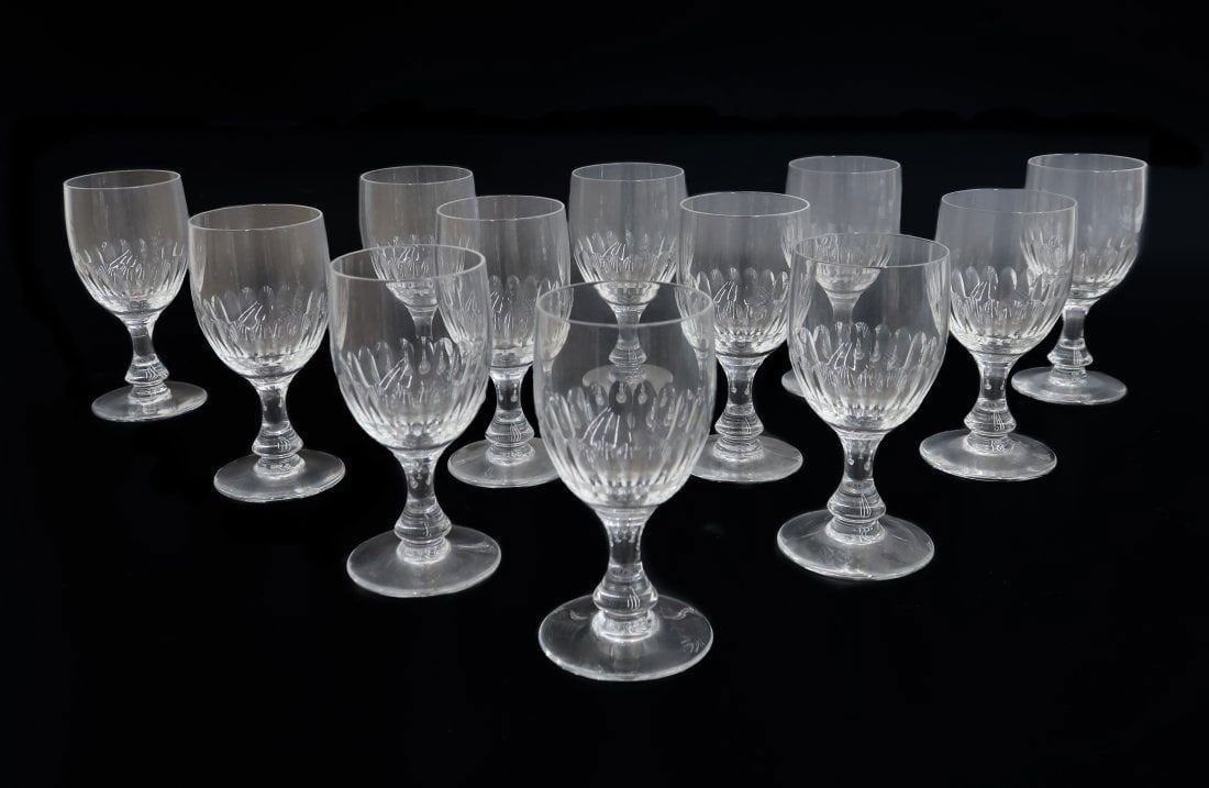 12 Baccarat France Cut Glass Claret Wine Goblets in Odeon: 12 Baccarat France Cut Glass Claret Wine Goblets in Odeon. Thumbprint design to bowl. Acid etched "Baccarat France" mark to underside. Weight: Approx. 6 lbs Measurements: Approx.2.25 inches diameter x