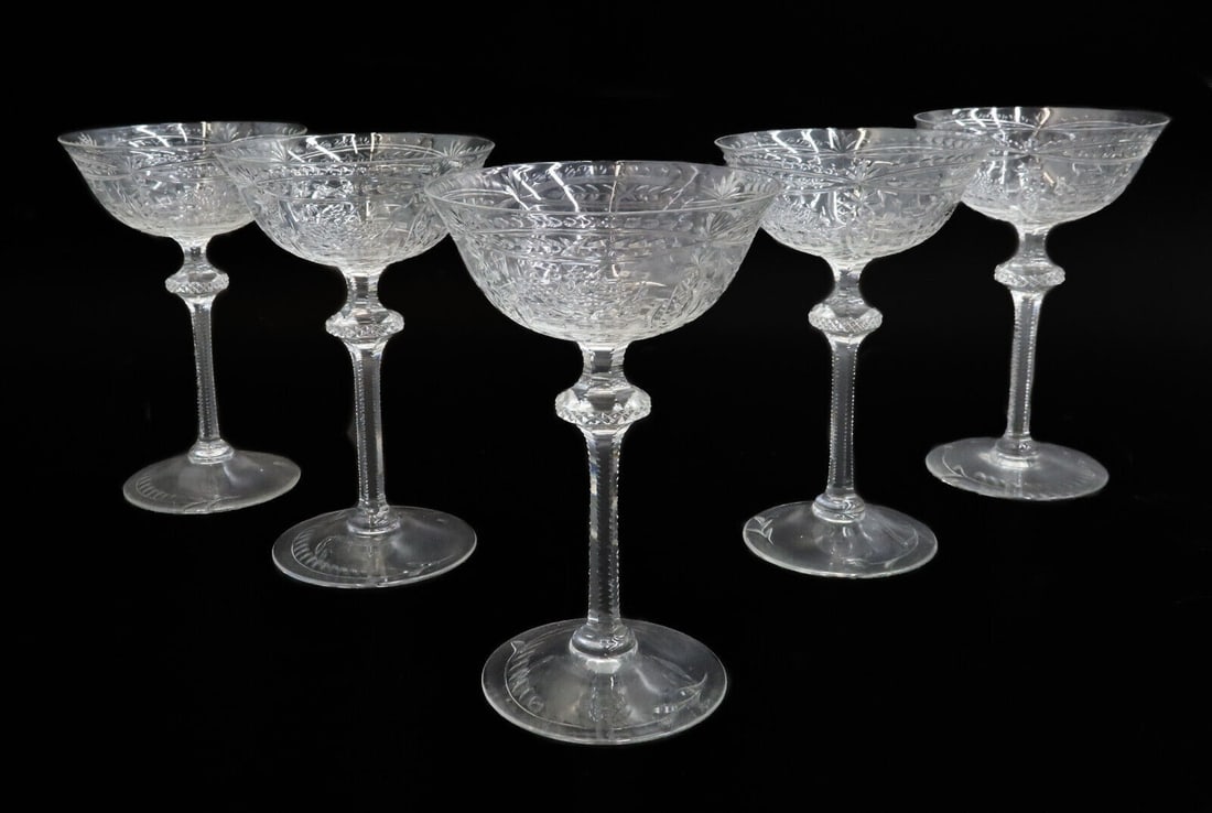 5 English Cut Glass Emulating Rock Crystal Champagne Saucers Sherbet Early 20 C: 5 English cut glass emulating rock crystal champagne saucers sherbet goblets, Early 20 Century. Engraved fruit baskets, and star designs throughout. Weight: Approx. 1 lb Measurements: Approx. 4.25 inc