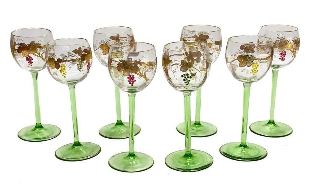 8 Continental Glass Wine Goblets: 8 Continental glass wine goblets, circa 1940. Hand painted enamel green, yellow, and purple grapes to the exterior of the bowl with gilt encrusted leaf accents. Green art glass stems and bases. Weight
