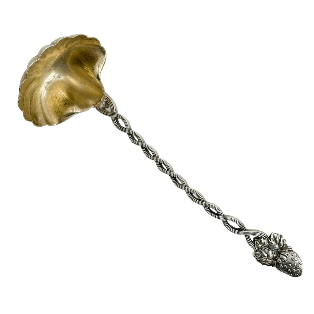 Tiffany & Co Pierced Gilt Sterling Silver Pierced 7 in Ladle Berry: Tiffany & Co Pierced Gilt Sterling Silver Ladle. Pierced silver handle, straw berry to the end. Shell shaped bowl with gilt finish. Underside marked Tiffany & Co Makers Weight: Approx. 1.6 ozt Measure