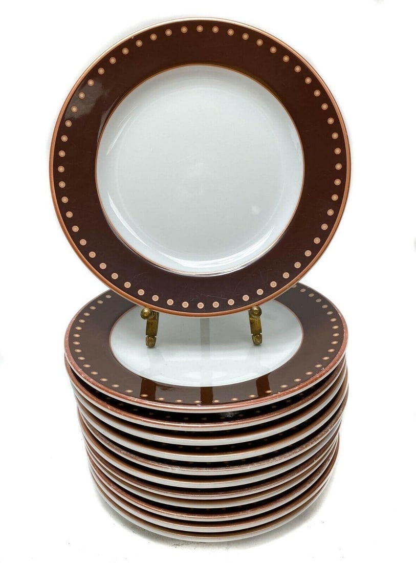 12 Bernardaud Porcelain Bread or Cake Plates Brown Polka Dot: 12 Bernardaud Brown Polka Dot Rimmed Bread or Cake Plates. Weight: Approx. 7.2 lbs Measurements: Approx. 6.5 in. diameter x 0.5 in. tallCondition: Good condition. Utensil marks and wear consistent wit
