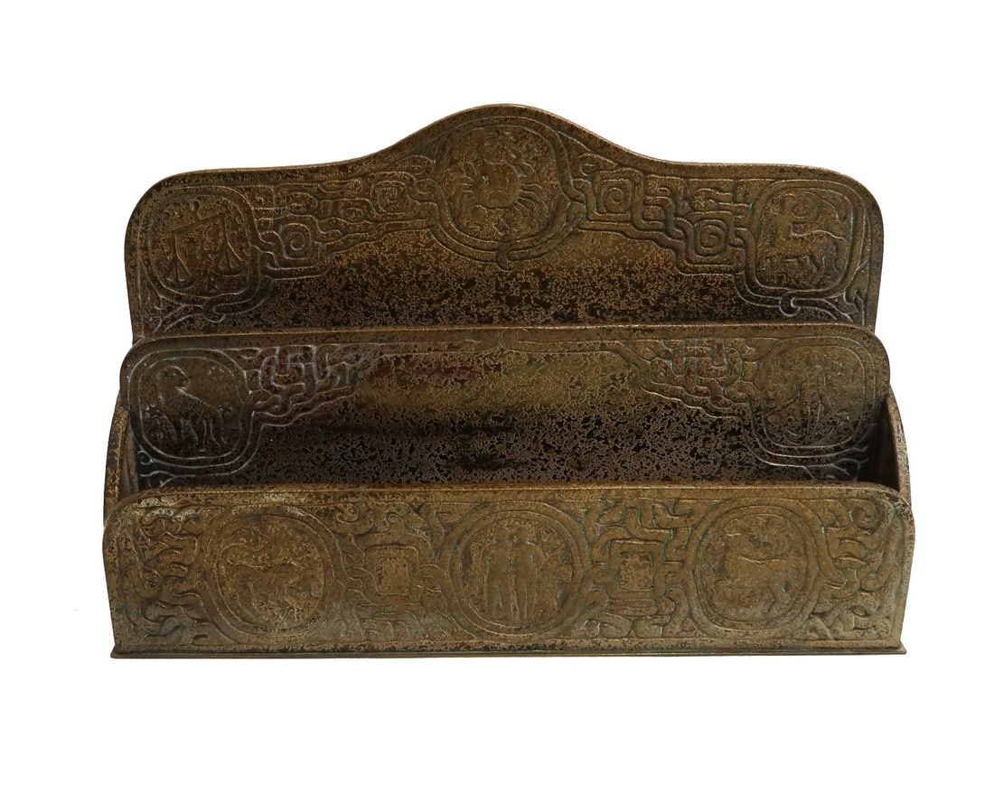 Tiffany Studios New York Gilt Bronze Paper Rack in Zodiac #1009 circa 1900: Tiffany Studios New York Gilt Bronze paper rack in zodiac #1009, circa 1900. Engraved astrological zodiac figures throughout. Tiffany Studios mark to underside. Weight: Approx. 2 lb Measurements: Appr