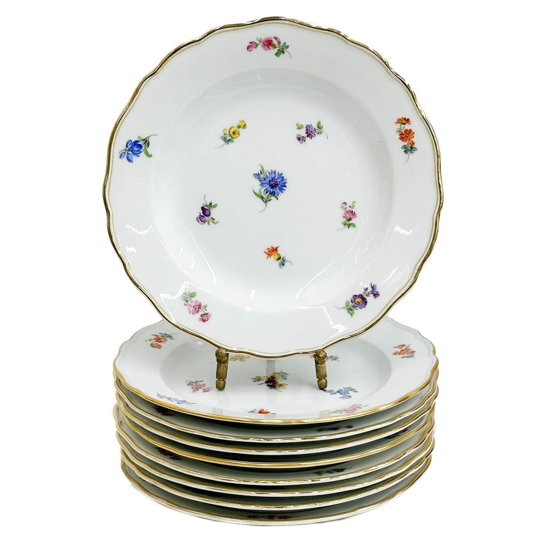 9 Meissen Germany Hand Painted Porcelain Floral Dessert Plates early 20th cen: 9 Meissen Germany Hand Painted Porcelain Floral Dessert Plates, early 20th century. A white ground decorated with florals, gilt to the scalloped rim. Underside with crossed swords marks Weight: Approx