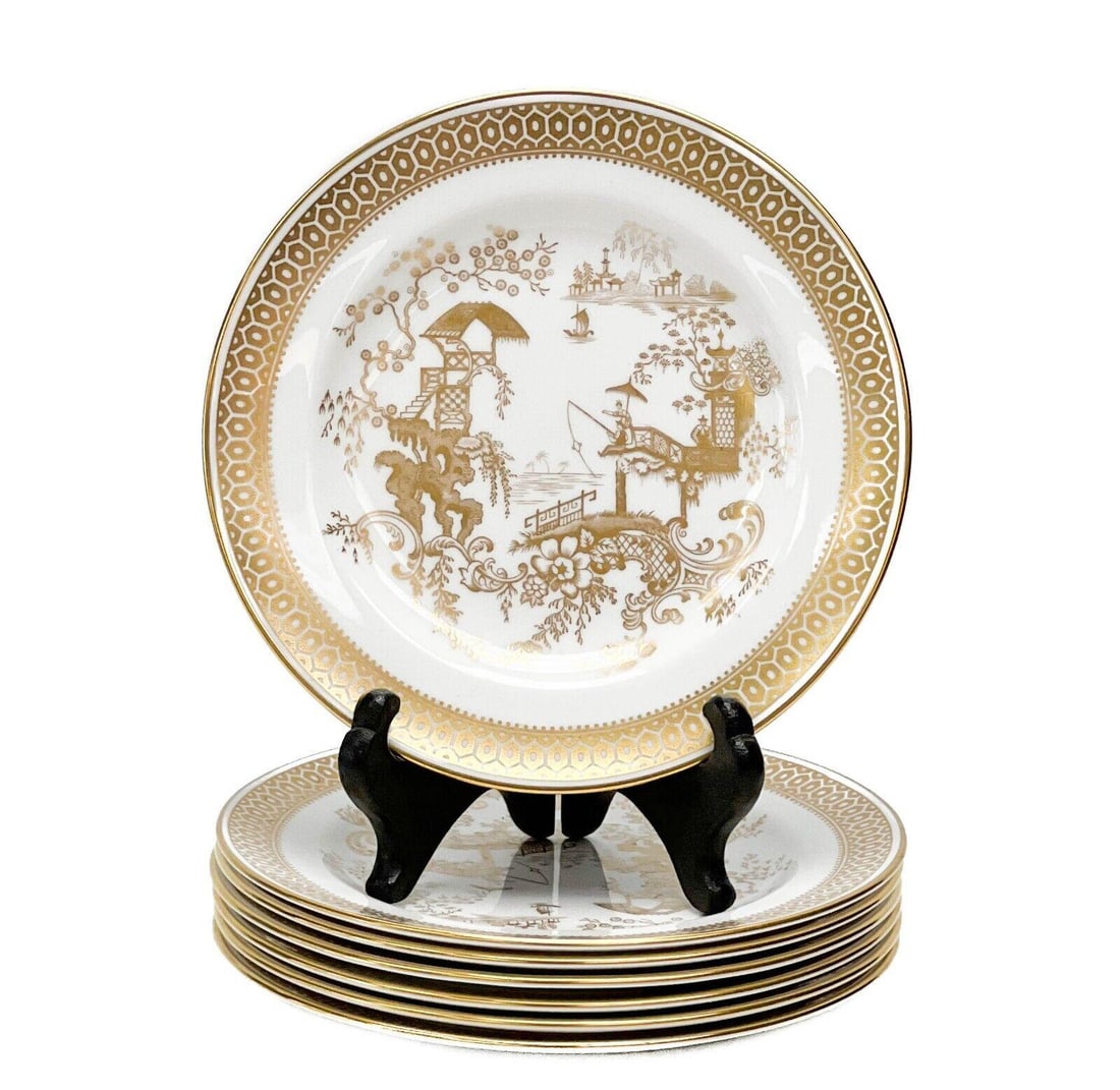 7 Spode England Gilt Porcelain Bread Plates in Spode's Garden Gold: 7 Spode England porcelain bread plates in Spode's Garden. A white ground with ornate gilt image to the center of figures fishing, geometric decoration to the edge. Gilt to the rim. Underside marked Sp