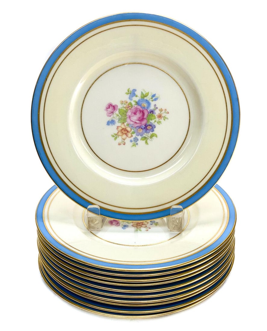 11 Lenox Porcelain 8.25 inch Dessert Plates, Floral Bouquet , circa 1950: 11 Lenox porcelain 8.25 inch dessert plates, Floral Bouquet , circa 1950. A sky blue trim to the pale yellow ground with multi-colored floral bouquets to the center. Lenox marks to the underside base.