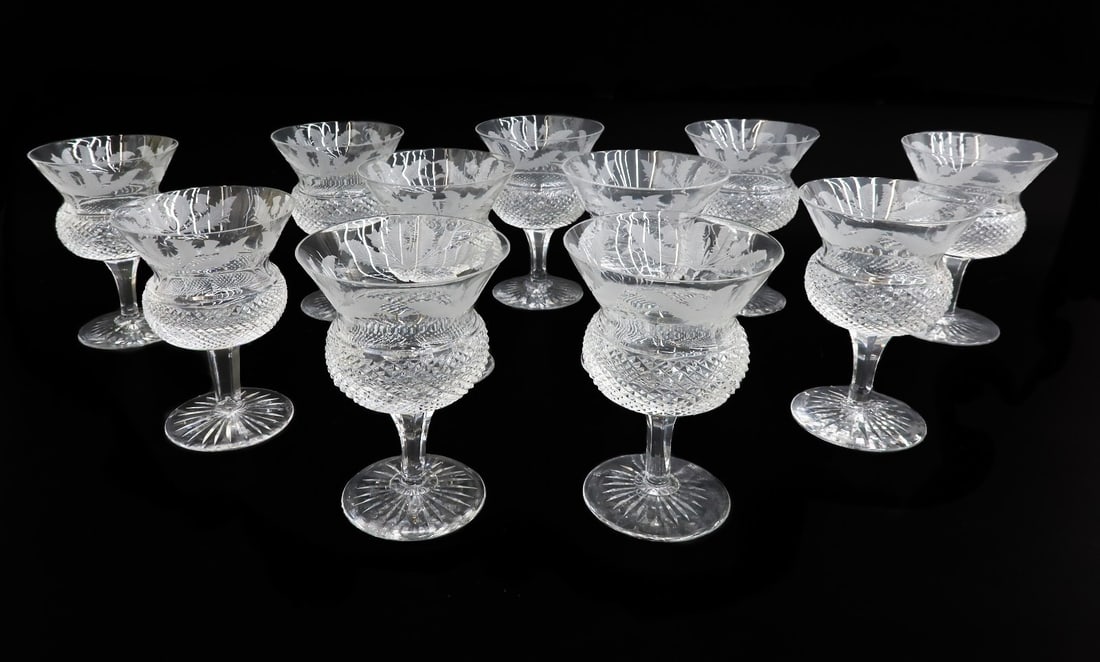11 Edinburgh Scotland Crystal Cut Glass Tall Sherbet Glasses in Thistle: 11 Edinburgh Scotland crystal cut glass tall sherbet glasses in Thistle. Cut cross hatches etched thistle flowers to circular band. Starburst design to underside. Marked to underside. Weight: Approx.
