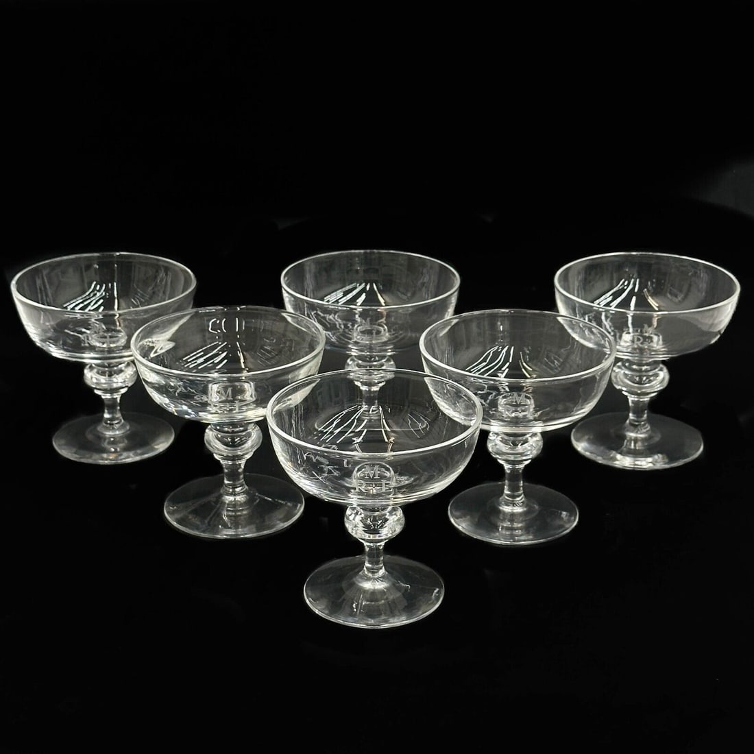 6 Steuben Art Glass Champagne / Tall Sherbet Glasses in 7925 MRL Monogram: 6 Steuben Art Glass Champagne / Tall Sherbet Glasses in 7925. Engraved monogram MRL to the side. Underside etched Steuben. Weight Approx., 3.5 lbs Measures Approx., 4 inches diameter x 3.825 inches