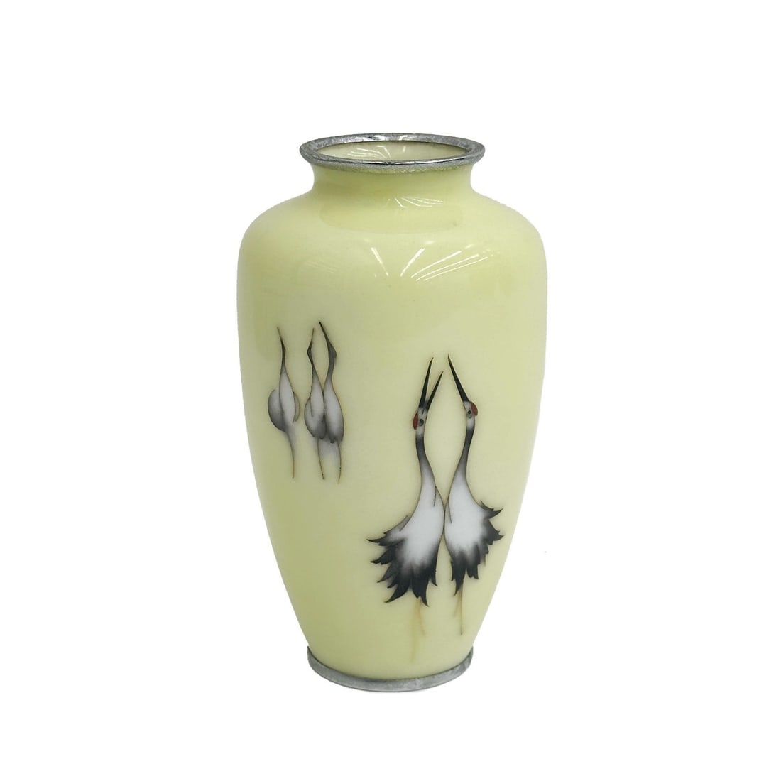 Yukio Tamura Japanese Cloisonne Enamel Vase Cranes Showa Period: Yukio Tamura Japanese Cloisonne Enamel Vase, Showa period. A yellow ground decorated with cranes. Silver plated Underside edge marked Tamura ??? Weight: Approx. 1.5 lbs Measurements: Approx. 4 inches