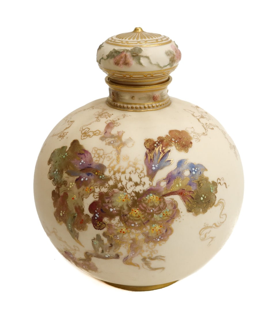 Royal Crown Derby England Porcelain Round Lidded Urn, 1890. Florals and Enamel: Royal Crown Derby England porcelain round lidded urn, 1890. Peach ground with florals to center and multi-color enamel dots throughout. Royal Crown Derby to underside dating to 1890. Approximate weigh