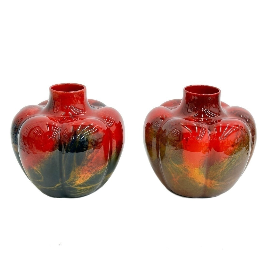 Pair Royal Doulton Porcelain Sung Ware Noke Flambe Squat Form Vases, circa 1930: Pair Royal Doulton Porcelain Sung Ware Noke Flambe Squat Form Vases, circa 1930. Lobed panels with vibrant purple, yellow, green, and blue abstract colors to the bright red base. Royal Doulton mark to
